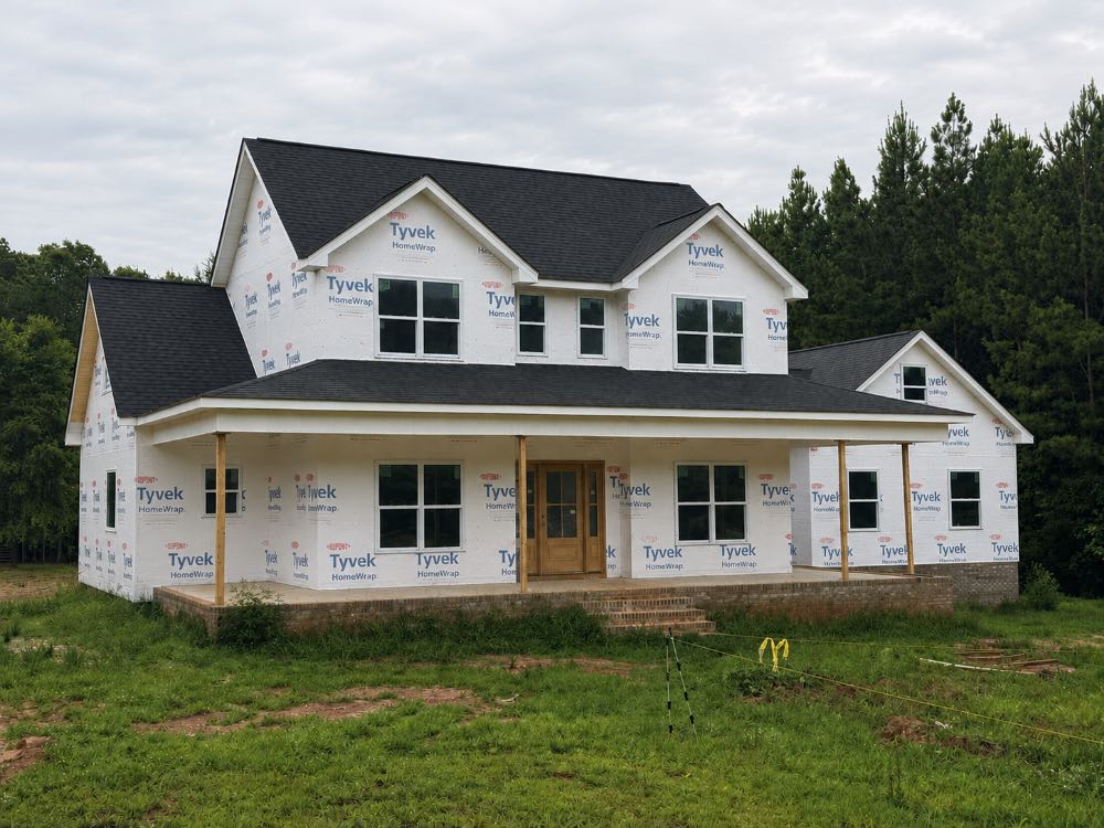 Home before vinyl siding installation